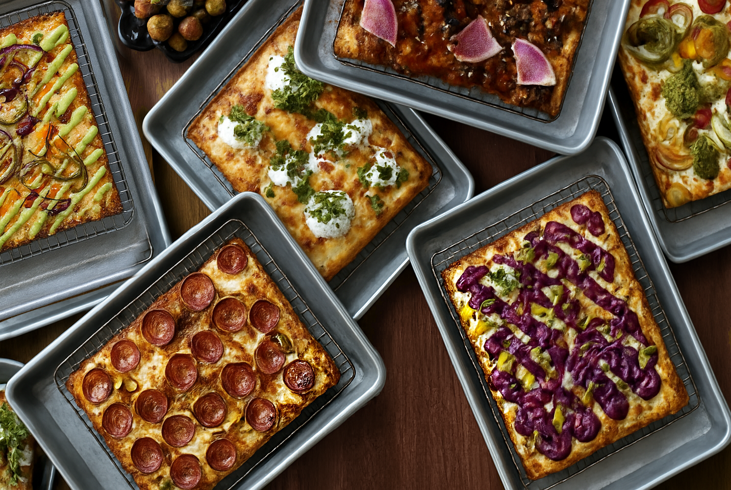 Crispy edge Detroit-style pizza on haunted-themed dish